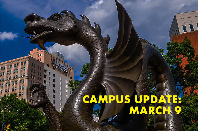 Dragon statue with words Campus Update March 9